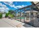 The screened-in pool area features comfortable seating and a paved patio, perfect for relaxation and entertaining at 7218 Darlington St, Englewood, FL 34224