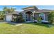 Beautiful home featuring manicured lawn, mature landscaping and an attached garage at 7376 Stetson Ln, Port Charlotte, FL 33981