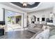 Open-concept living room with access to the patio, dining area, and kitchen creating a seamless flow at 7376 Stetson Ln, Port Charlotte, FL 33981