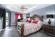 Elegant main bedroom featuring a tray ceiling, dark wood furniture, and stylish décor at 7376 Stetson Ln, Port Charlotte, FL 33981