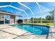 Beautiful screened-in pool with outdoor lounge, offering a relaxing space to unwind at 7376 Stetson Ln, Port Charlotte, FL 33981