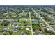 Spacious lots and a verdant tree canopy define this neighborhood's aerial perspective at 7437 Bass St, Englewood, FL 34224