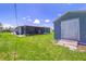 This property includes a spacious backyard with large storage shed, and screened in patio at 7437 Bass St, Englewood, FL 34224