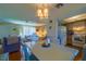 Open dining area with hardwood floors and views of the cozy living room and well-equipped kitchen at 7437 Bass St, Englewood, FL 34224