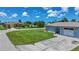 Charming single-story home with a well-manicured lawn and attached one car garage at 7437 Bass St, Englewood, FL 34224