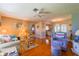 Inviting living room with hardwood floors, comfortable seating, and a seamless flow into the dining area at 7437 Bass St, Englewood, FL 34224