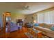 Spacious living room with hardwood floors, comfortable seating, and a bright, airy atmosphere at 7437 Bass St, Englewood, FL 34224