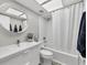 Modern bathroom features a shower/tub with decorative mirror and vanity at 7486 Palm Island Dr # 2413, Boca Grande, FL 33921