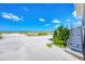 Beach access featuring stairwell and greenery at 7486 Palm Island Dr # 2413, Boca Grande, FL 33921