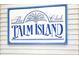 The Palm Island club sign with a palm tree design, enhancing the island feel at 7486 Palm Island Dr # 2413, Boca Grande, FL 33921