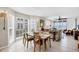 Bright dining area with large windows offering scenic ocean views, seamlessly connected to the living space at 7486 Palm Island Dr # 2413, Boca Grande, FL 33921