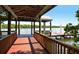 Wooden walkway leading to a community dock with waterfront views at 7486 Palm Island Dr # 2413, Boca Grande, FL 33921