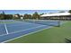 Enjoy a match on the community's pristine blue and green tennis courts with ample seating and a covered pavilion at 7486 Palm Island Dr # 2413, Boca Grande, FL 33921