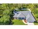 An aerial view shows the roof and large fenced yard of this single Gathering home at 7933 Minardi St, North Port, FL 34291
