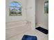 Bright bathroom featuring a soaking tub and large window with a view at 7933 Minardi St, North Port, FL 34291