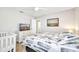 Comfortable bedroom with a large bed, dresser and crib at 7933 Minardi St, North Port, FL 34291