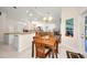 Open floorplan combines dining area with kitchen and living areas for modern, easy living at 7933 Minardi St, North Port, FL 34291
