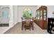 Dining room with ample light, classic furnishings, and a large window at 7933 Minardi St, North Port, FL 34291