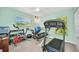 Bright exercise room with multiple windows and various workout equipment at 7933 Minardi St, North Port, FL 34291