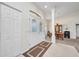 This bright entryway welcomes you with decorative double doors and tile flooring at 7933 Minardi St, North Port, FL 34291
