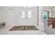 Bright foyer features tile flooring and double front doors with decorative glass at 7933 Minardi St, North Port, FL 34291