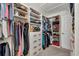 Organized walk-in closet with custom shelving, drawers, and ample hanging space for clothes and accessories at 7933 Minardi St, North Port, FL 34291