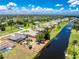 An aerial perspective displays the property's layout and location along the tranquil waterfront canal at 926 Boundary Blvd, Rotonda West, FL 33947