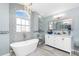 Bright bathroom featuring a soaking tub, dual vanities, and elegant fixtures, perfect for relaxation and pampering at 926 Boundary Blvd, Rotonda West, FL 33947