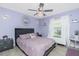 Bedroom featuring purple decor, a comfortable bed, and decorative lighting fixtures at 926 Boundary Blvd, Rotonda West, FL 33947