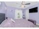 Bedroom featuring purple decor, a comfortable bed, and decorative lighting fixtures at 926 Boundary Blvd, Rotonda West, FL 33947