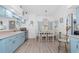 Charming dining area featuring a decorative chandelier and beach themed décor, creating an inviting atmosphere at 926 Boundary Blvd, Rotonda West, FL 33947