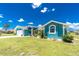 Inviting single-Gathering home with a well-maintained lawn, lush landscaping and a two car garage at 926 Boundary Blvd, Rotonda West, FL 33947