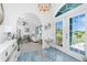 Bright foyer featuring blue tile floors, stylish decor, and a seamless transition into the open-concept living space at 926 Boundary Blvd, Rotonda West, FL 33947