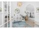 Inviting foyer with beautiful tiled flooring, decorative lighting, and arched entryway leading to the living area at 926 Boundary Blvd, Rotonda West, FL 33947