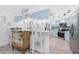 Open kitchen design with light blue cabinets, creating a bright and airy space perfect for cooking and entertaining at 926 Boundary Blvd, Rotonda West, FL 33947