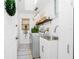 Well-lit laundry room featuring a modern washer and dryer, utility sink, and ample storage for convenience at 926 Boundary Blvd, Rotonda West, FL 33947