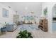 Spacious living room featuring bright walls, fan and light fixtures, and ample seating offering an inviting atmosphere at 926 Boundary Blvd, Rotonda West, FL 33947