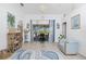 Comfortable living area with stylish décor, a cozy seating arrangement, and natural light from the sliding glass doors at 926 Boundary Blvd, Rotonda West, FL 33947