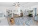 Bright and airy living room with modern furniture, stylish décor, and a seamless flow to the outdoor area at 926 Boundary Blvd, Rotonda West, FL 33947
