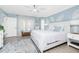 Airy main bedroom featuring serene light blue walls and a large, comfortable bed creating a relaxing retreat at 926 Boundary Blvd, Rotonda West, FL 33947