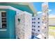 Quaint outdoor shower adorned with seashell decor for a beachside feel at 926 Boundary Blvd, Rotonda West, FL 33947