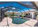 Stunning pool area enclosed with a screen, providing the ultimate in outdoor living at 926 Boundary Blvd, Rotonda West, FL 33947