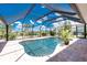 Sparkling pool surrounded by a screened enclosure, offering privacy and protection at 926 Boundary Blvd, Rotonda West, FL 33947