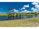 Scenic view of the waterfront from the backyard, showcasing the serene water feature at 926 Boundary Blvd, Rotonda West, FL 33947