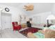 Bright living room with vaulted ceiling, ceiling fan, and tile flooring at 9457 Heartwellville Ave, Englewood, FL 34224