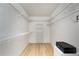 Organized walk-in closet with ample shelving and wood flooring at 9457 Heartwellville Ave, Englewood, FL 34224