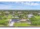Expansive aerial view of a single-Gathering home with a large lot, including a boat and RV parking area at 10263 Waterford Ave, Englewood, FL 34224