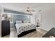 Cozy bedroom featuring stylish decor, wood floors, and a relaxing atmosphere at 10263 Waterford Ave, Englewood, FL 34224