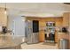 Updated kitchen featuring stainless steel appliances, granite countertops, and modern lighting for a sleek, efficient workspace at 10263 Waterford Ave, Englewood, FL 34224