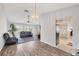 Inviting living room features lots of natural light, wood floors, and comfortable seating; perfect for relaxing or entertaining at 10263 Waterford Ave, Englewood, FL 34224